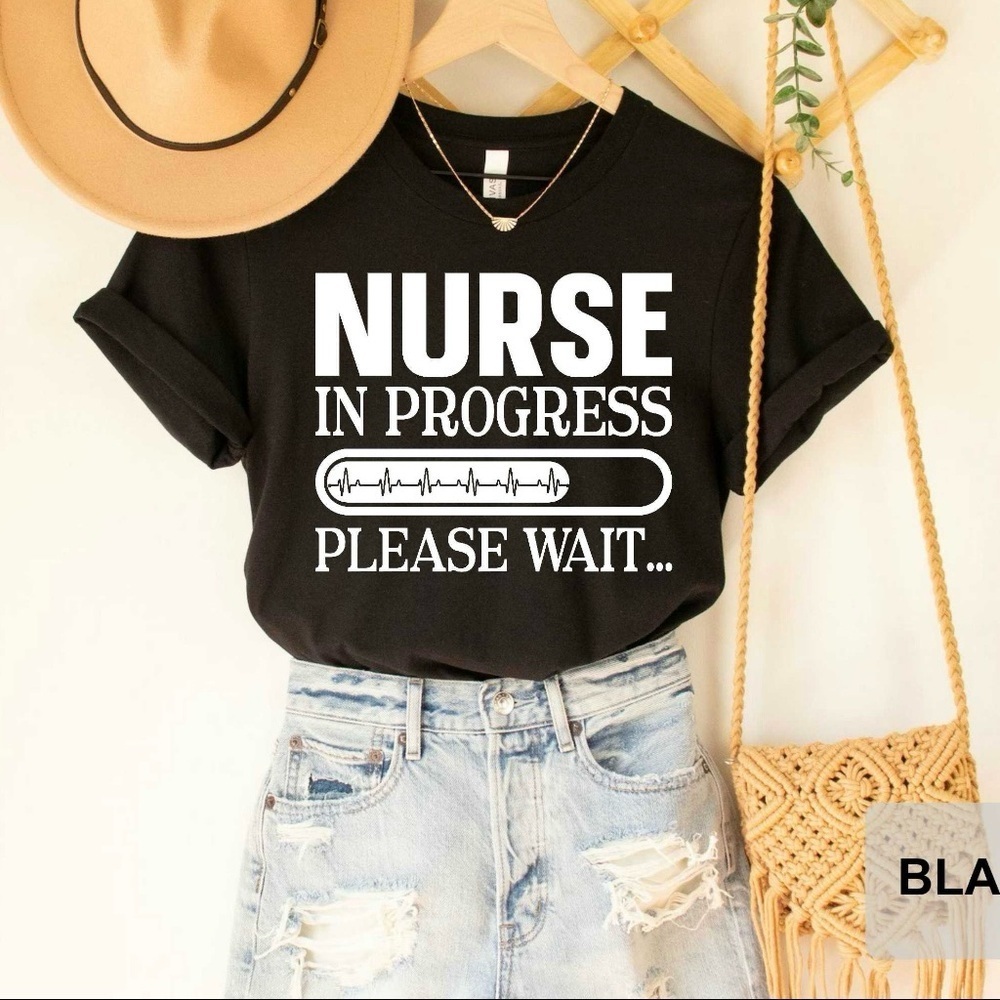 “Nurse in Progress – Please Wait” Graphic T-Shirt – Black
